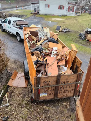 Brunk's Junk trailer loaded with furniture and construction debris