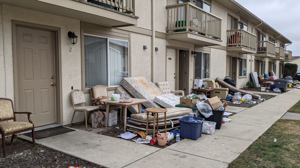 Professional crew cleaning out a residential unit for turnover